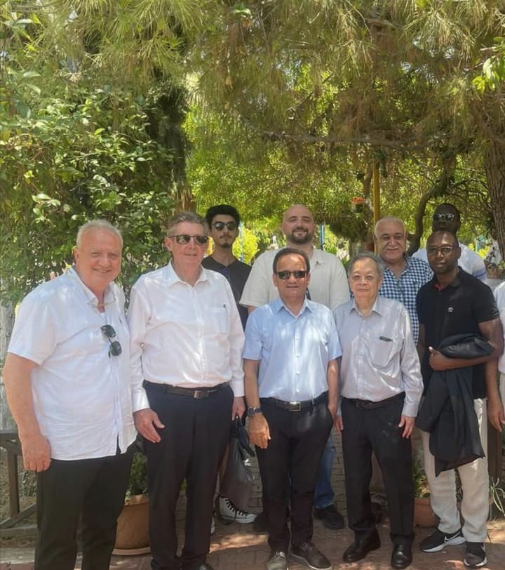 CEO of TEM Global with project evaluators on a project site visit